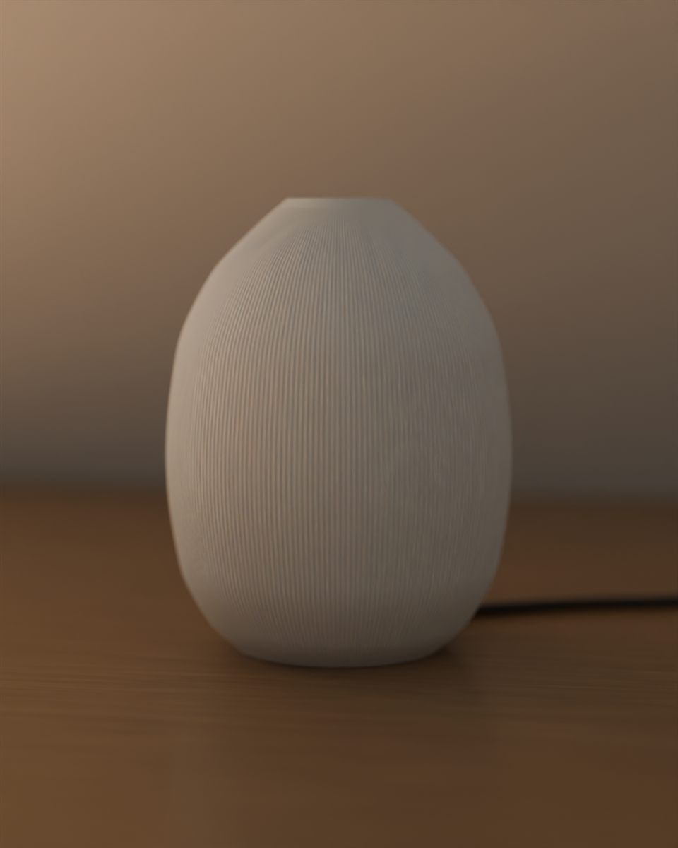 Reveal, switched off: a white fluted egg-shaped lamp, plain in daylight.